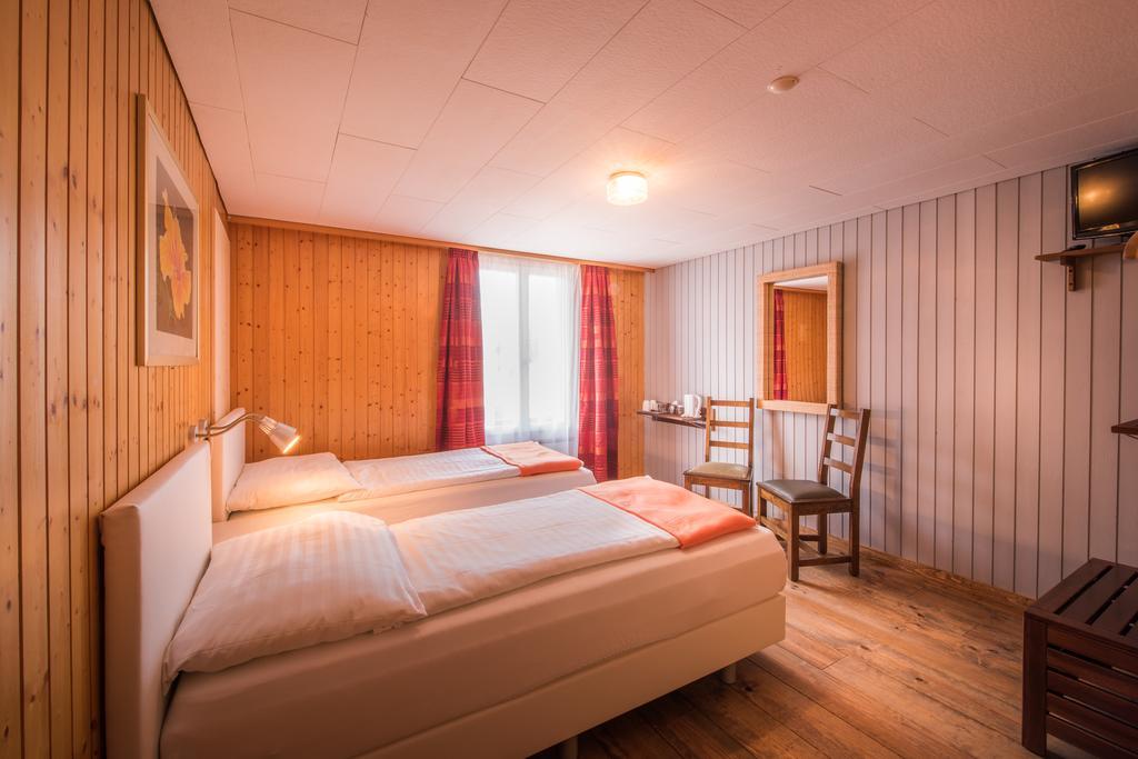 Hotel Tell And Apartments Unterseen Quarto foto